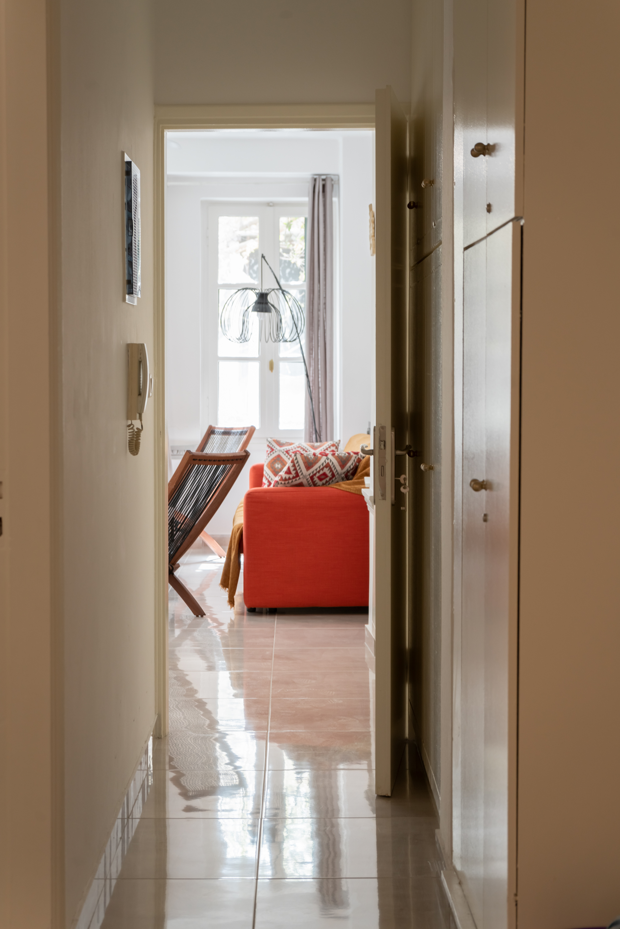 Hallway view towards living room - Spacious and well-lit corridor