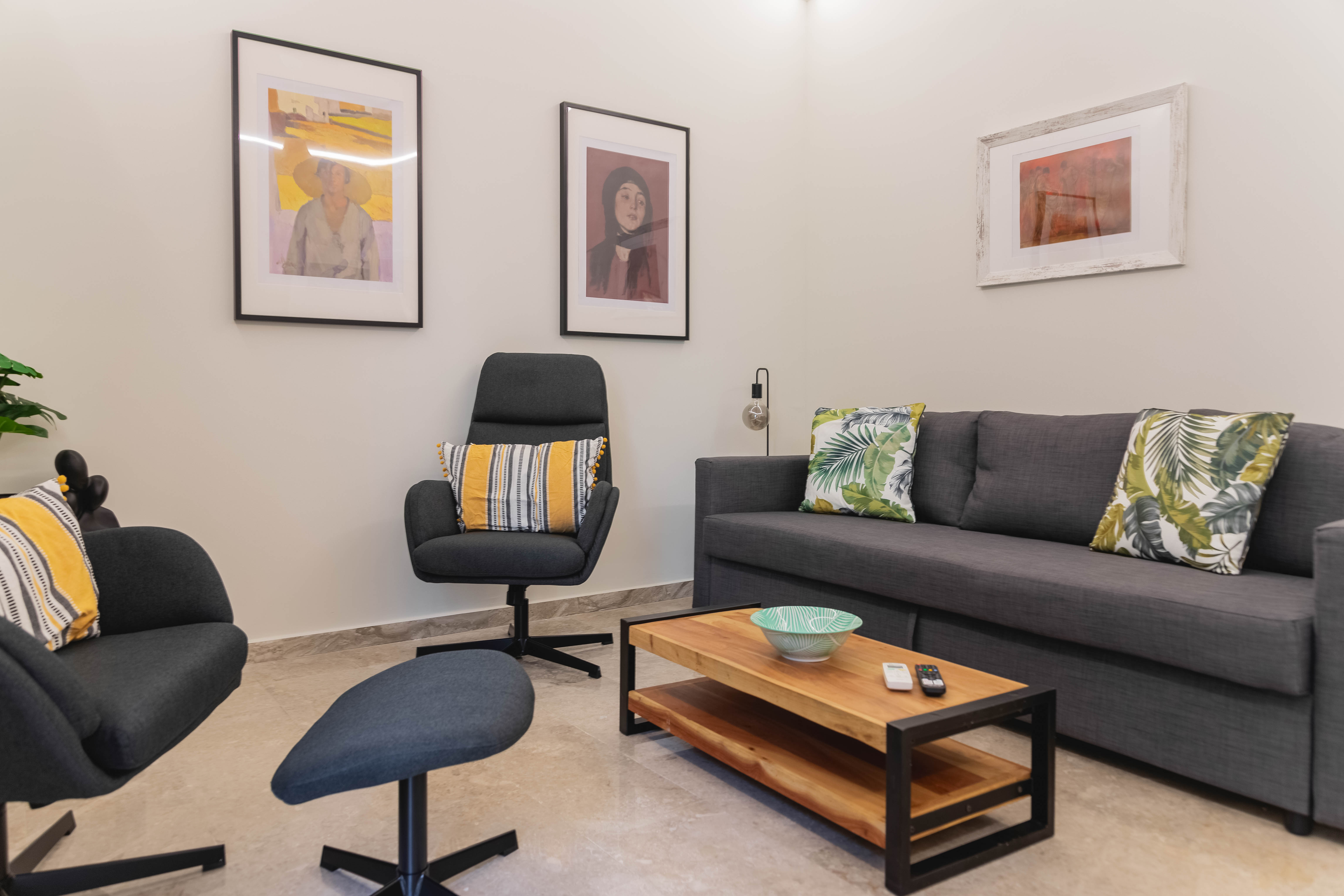 Modern living room with comfortable sofa and armchairs in Mets Gem