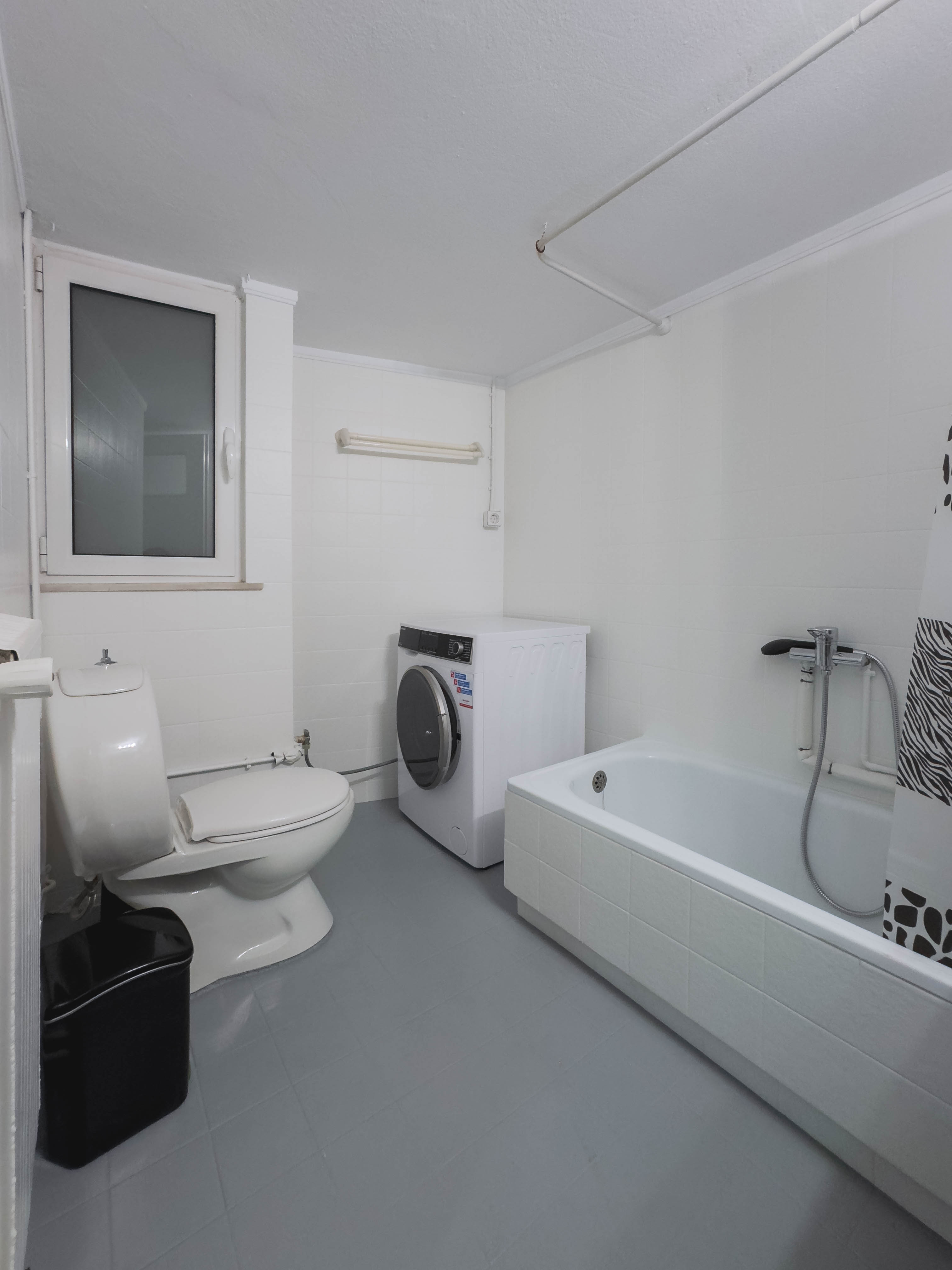 Modern full bathroom with shower in Mets Gem apartment