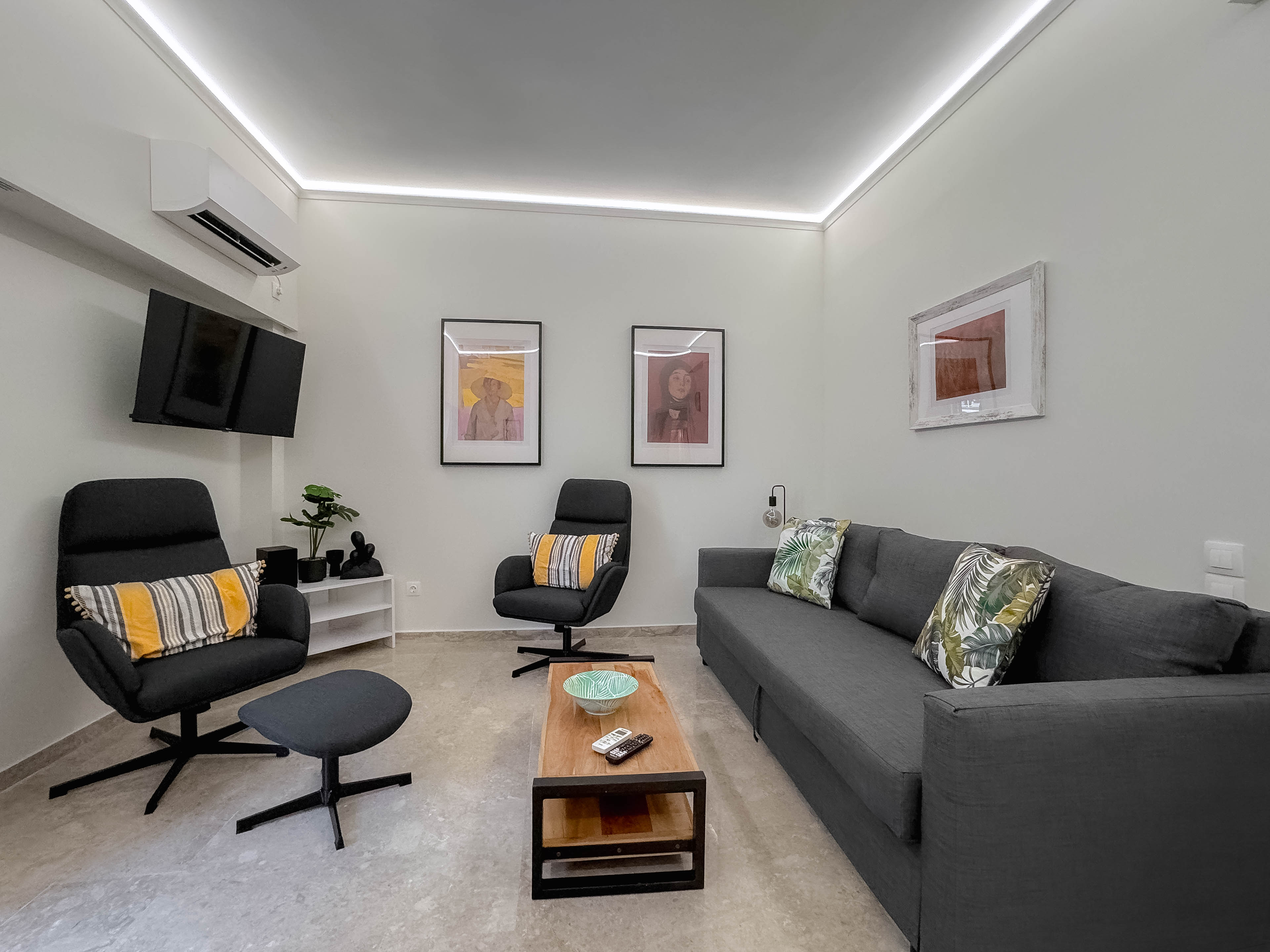 Spacious living room with modern furnishings in Mets Gem apartment