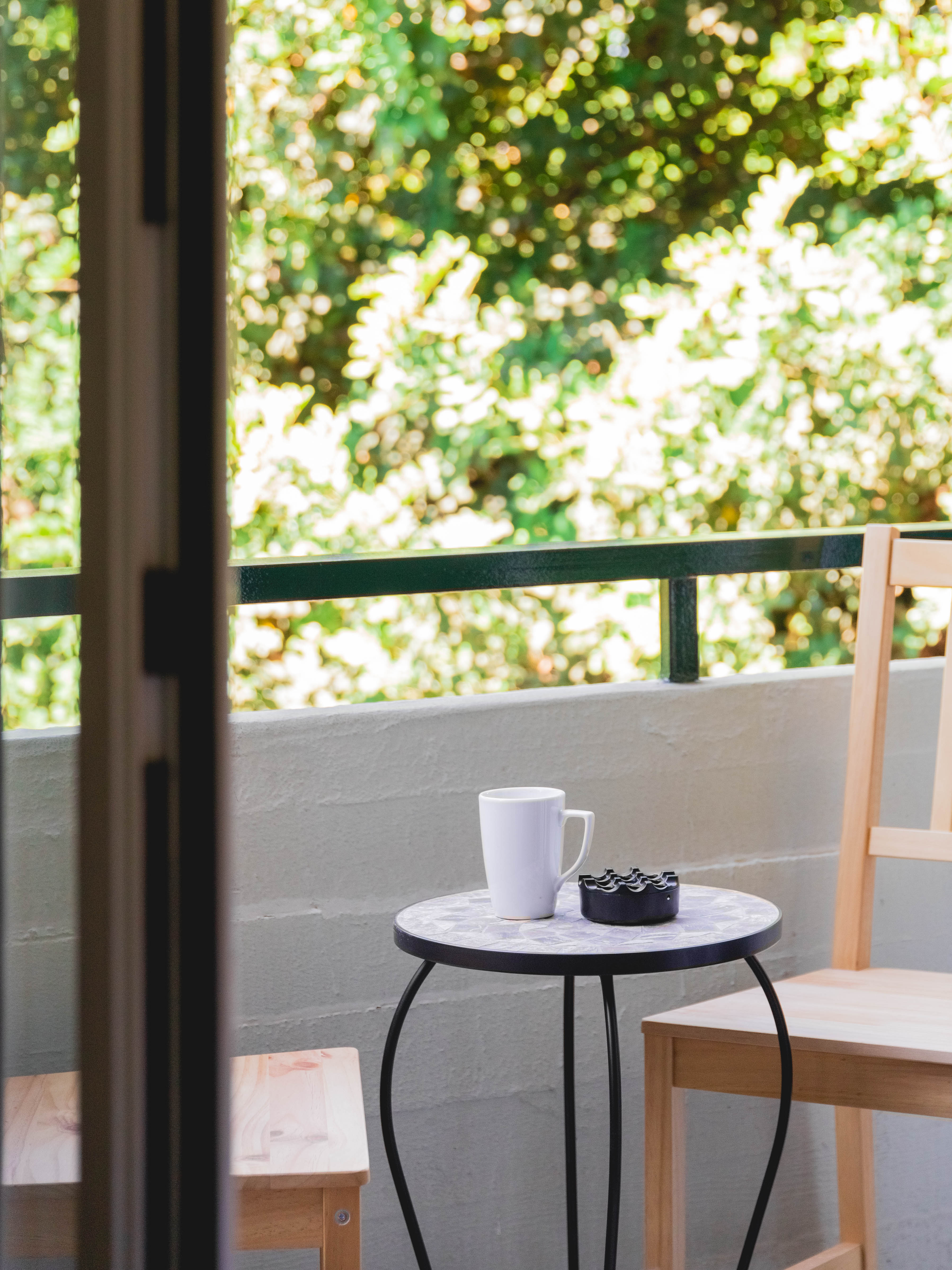 Cozy balcony seating area perfect for morning coffee