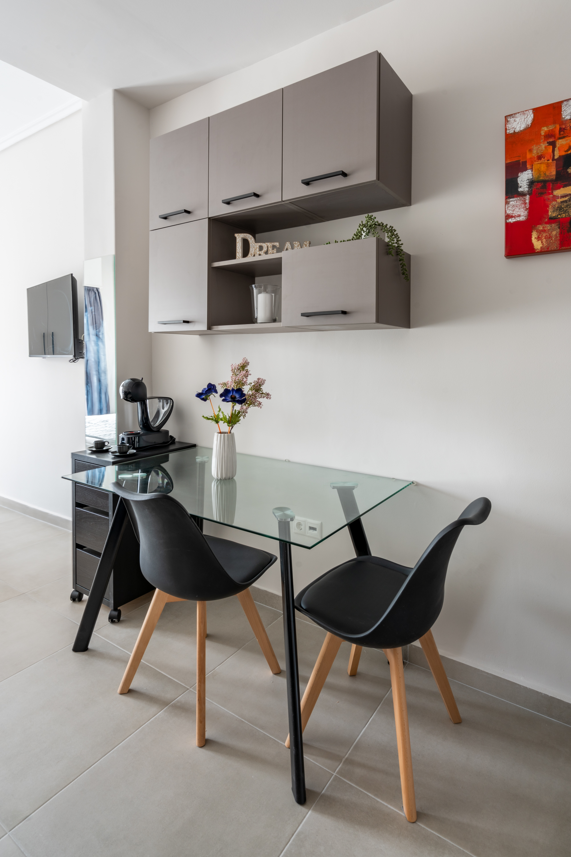 Stylish dining area with modern furniture in Neos Kosmos studio