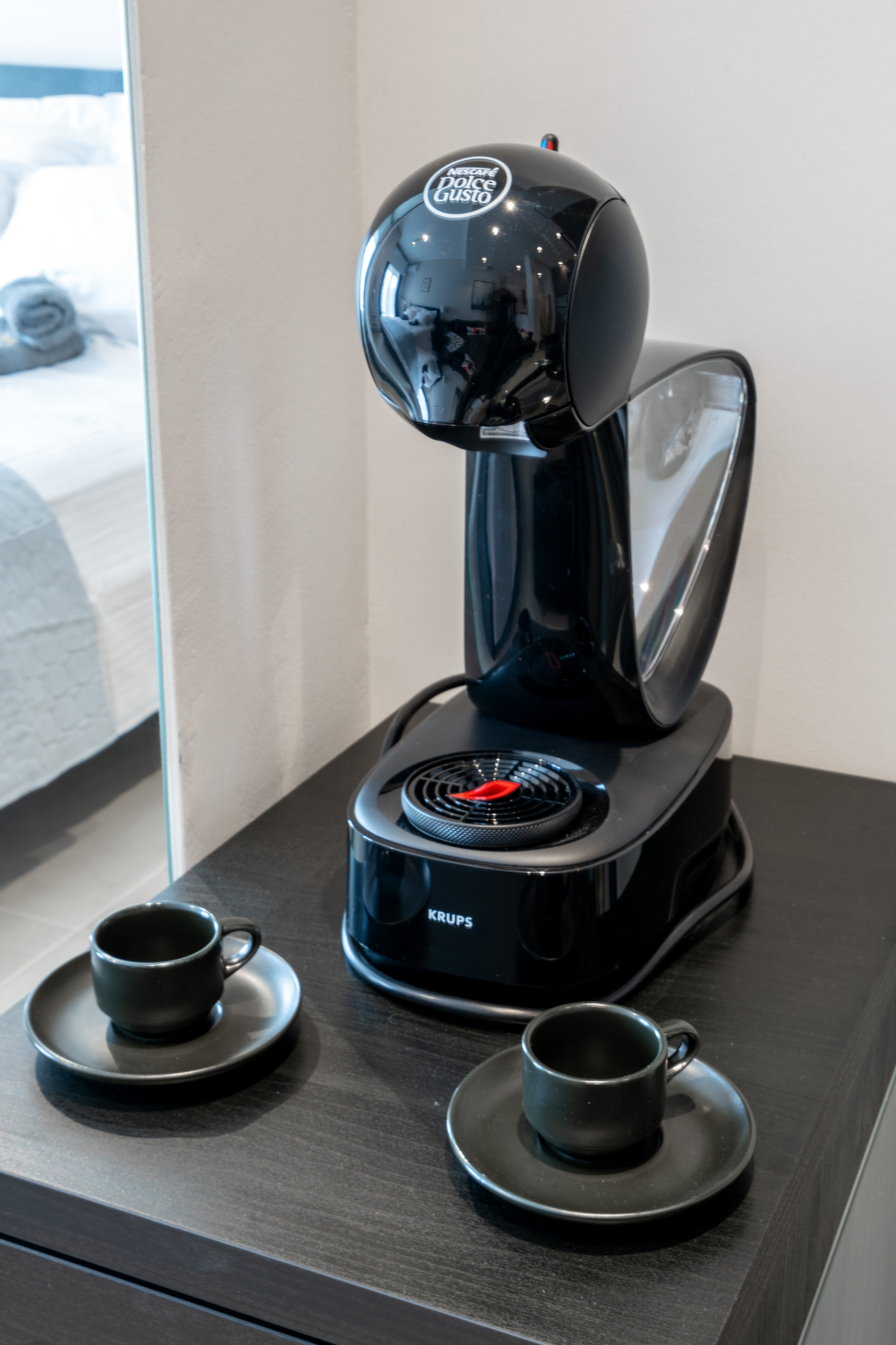Dolce Gusto coffee machine in fully equipped kitchen