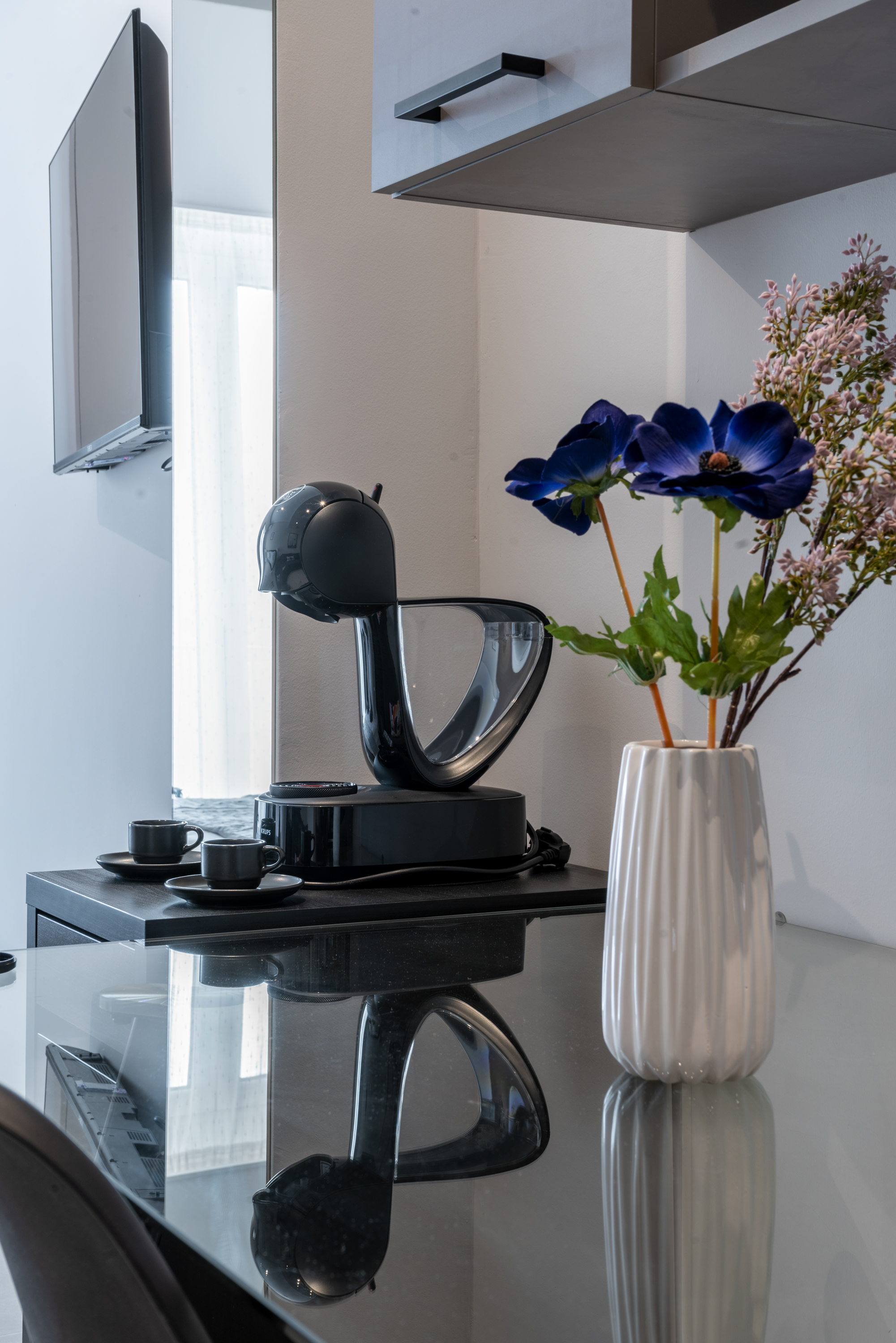 Close-up of Dolce Gusto coffee machine in kitchen