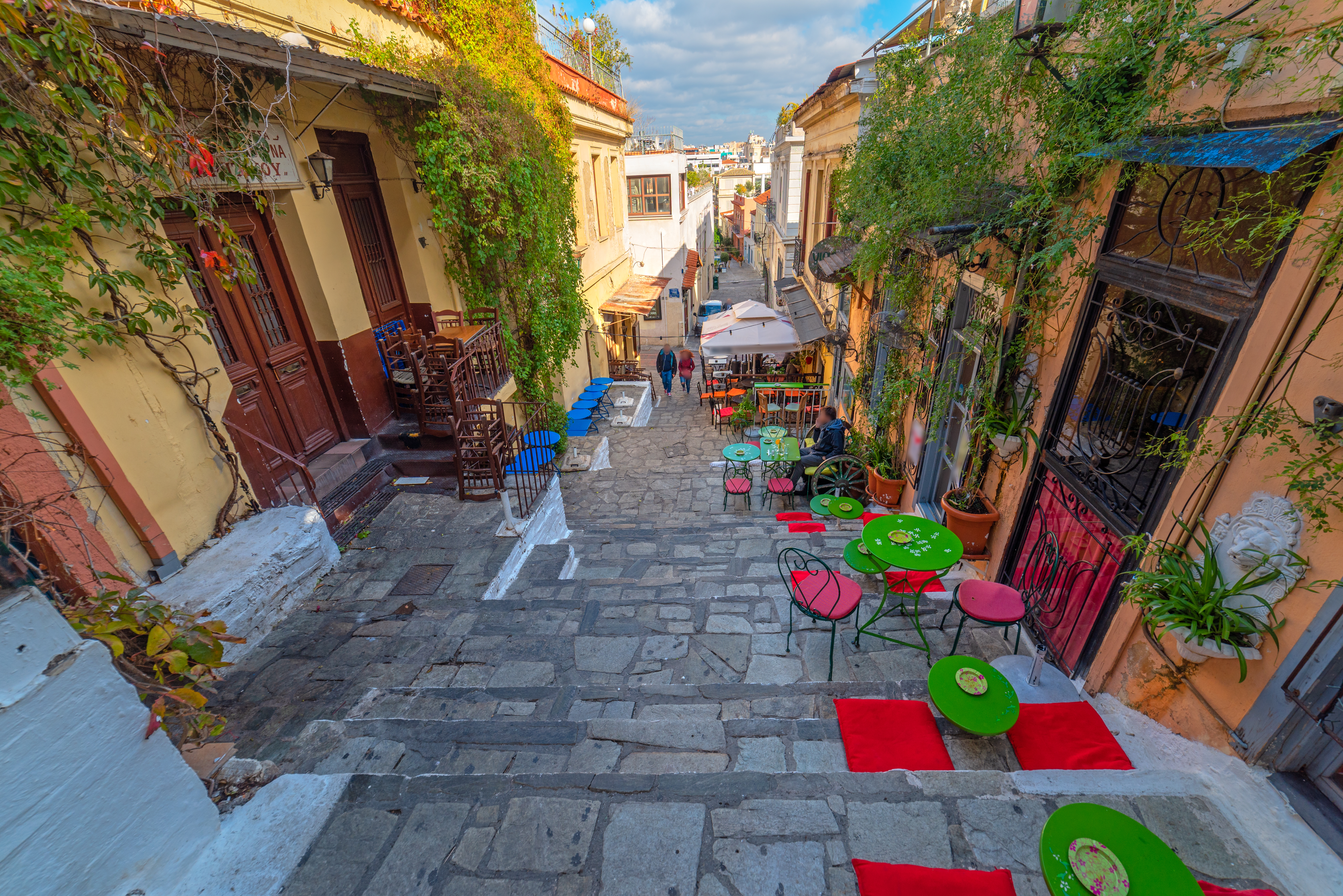 Street view of Neos Kosmos showing vibrant neighborhood life