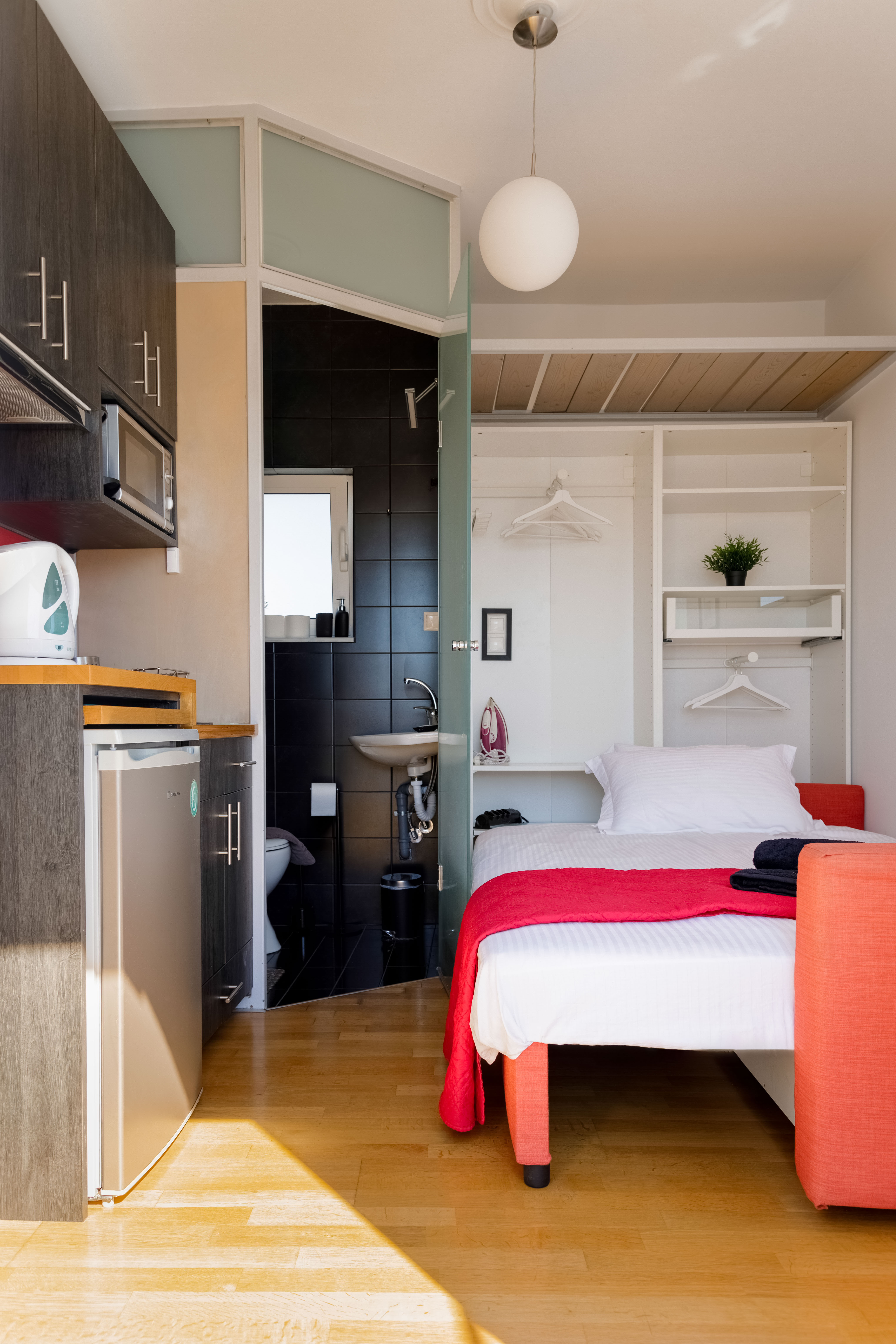 Bedroom area with comfortable bedding and storage
