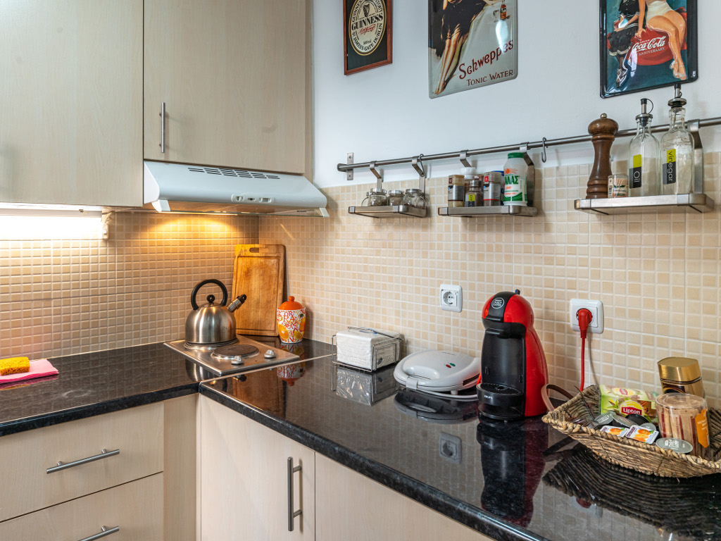 Kitchen with all essential appliances and cooking amenities